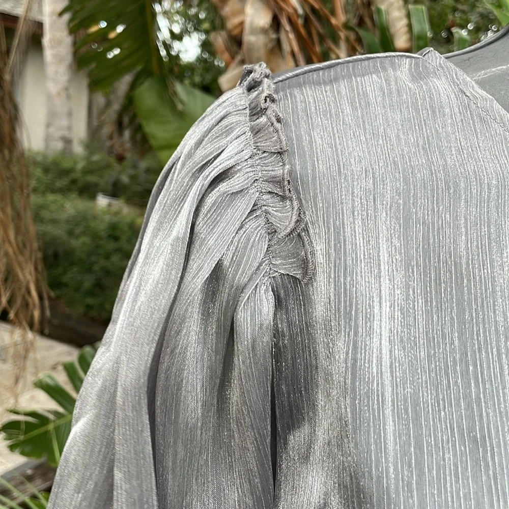 Free people  metallic silver top with statement sleeves